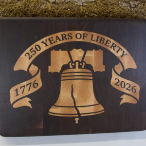 Liberty Bell end grain cutting board — walnut with maple inlay, top down view